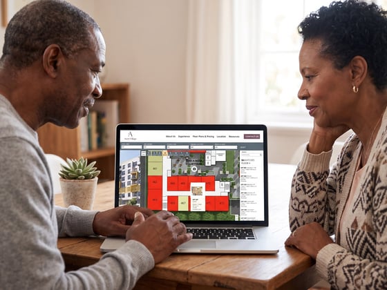 Older couple using SightMap on a laptop to browse for apartments.